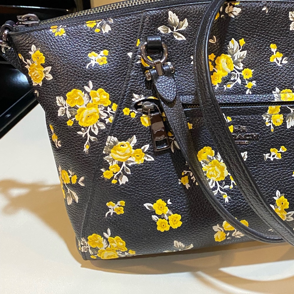 Coach -Black with yellow flowers coach handbag with shoulder strap. Zip close